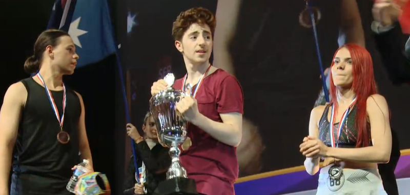 Umutcan (center) holding the Just Dance Word Cup trophy beside Pamela (right) and Uitregt left).